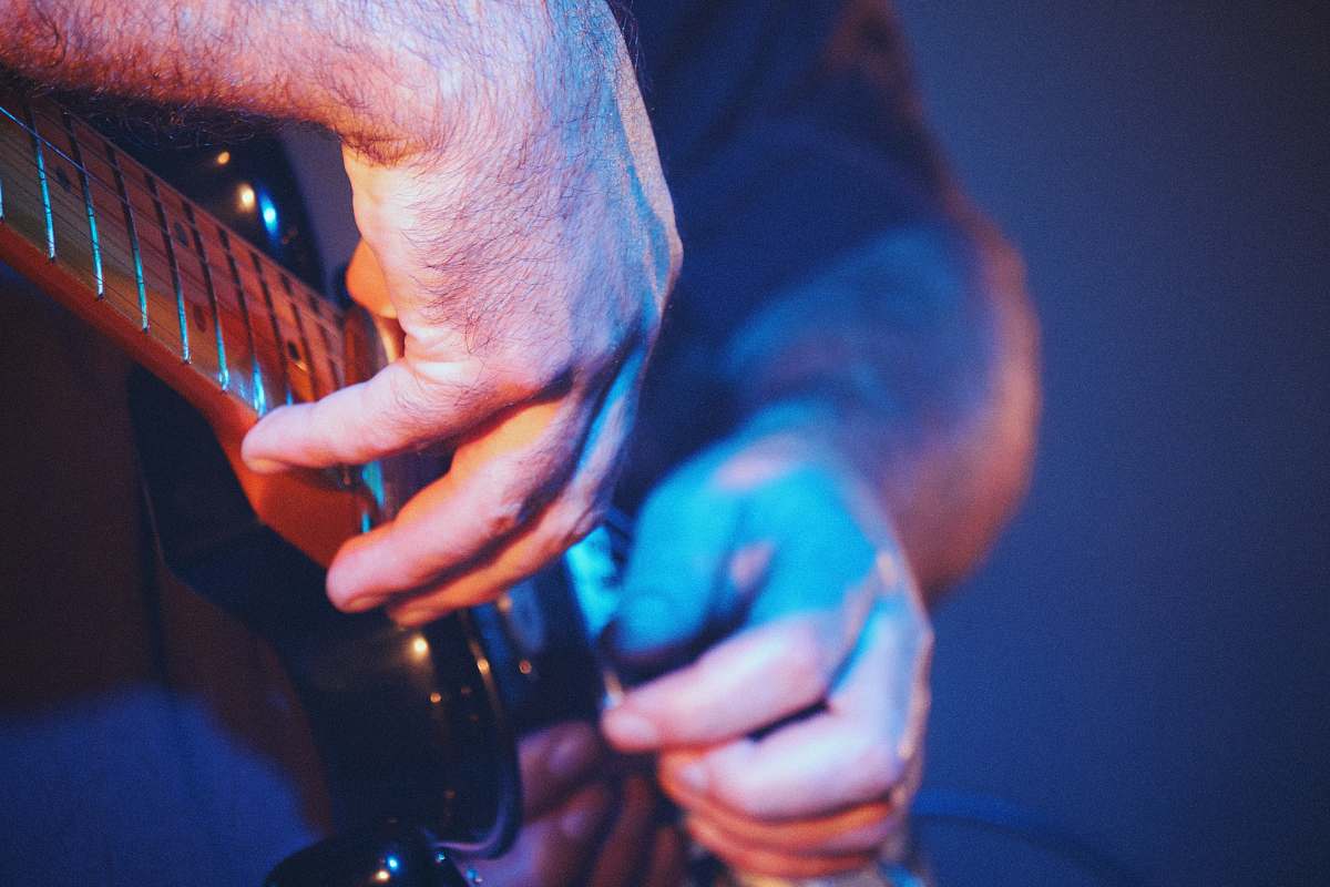 musical instrument man playing guitar leisure activities